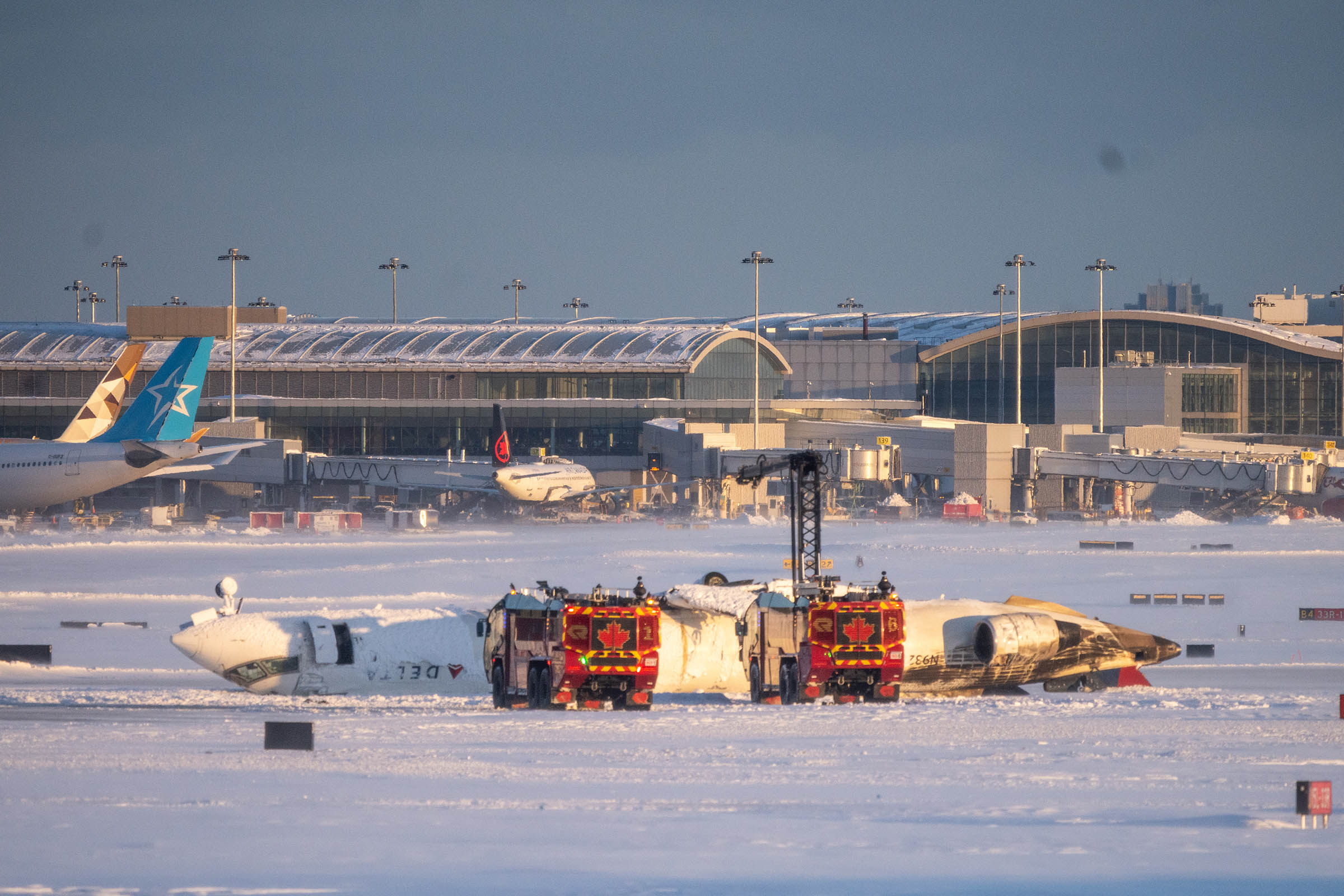 Delta jet flips upside down on a snowy Toronto runway and all 80 aboard survive