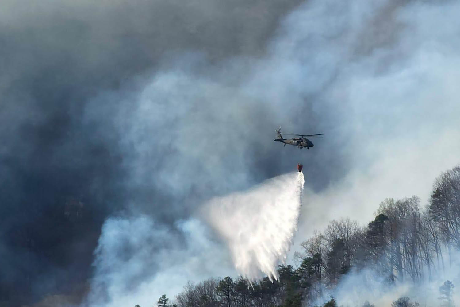 Firefighters in the Carolinas battle multiple wildfires as New Jersey crews contain a forest blaze