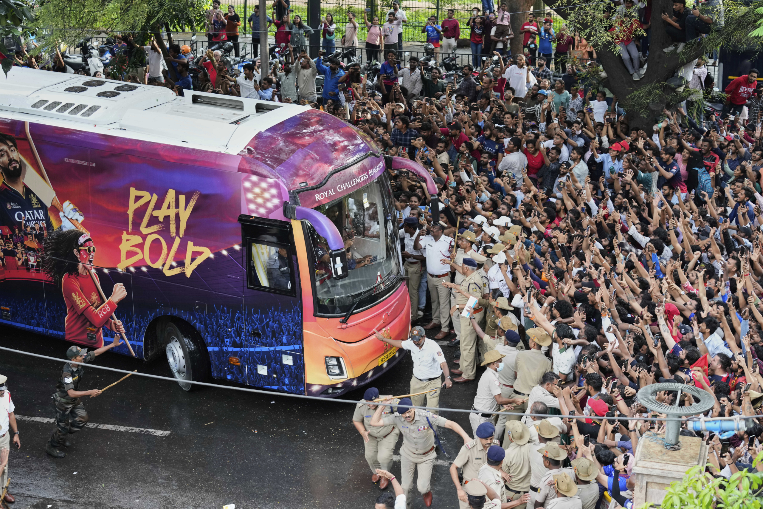At least 11 people die in a stampede outside a cricket stadium in India after IPL win